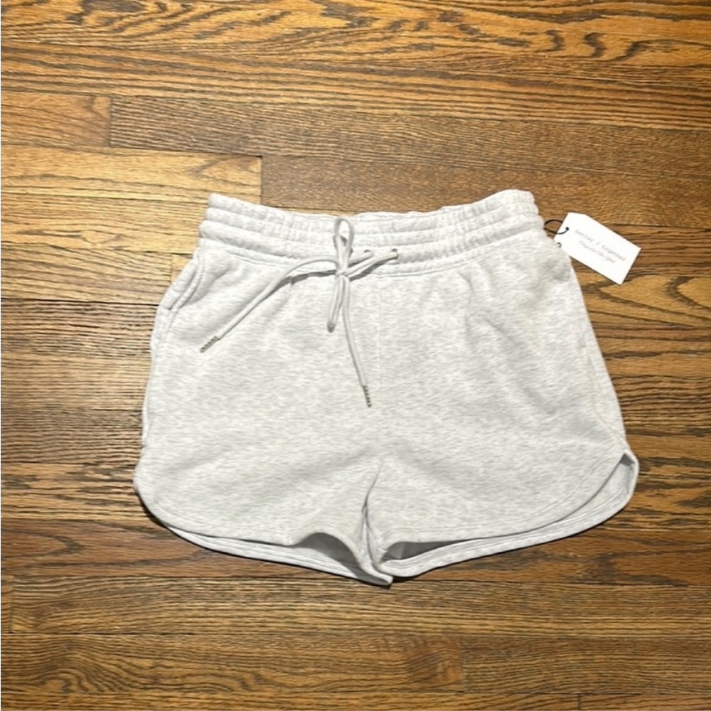 Gray Athletic Shorts with Elastic Waistband and Curved Hem